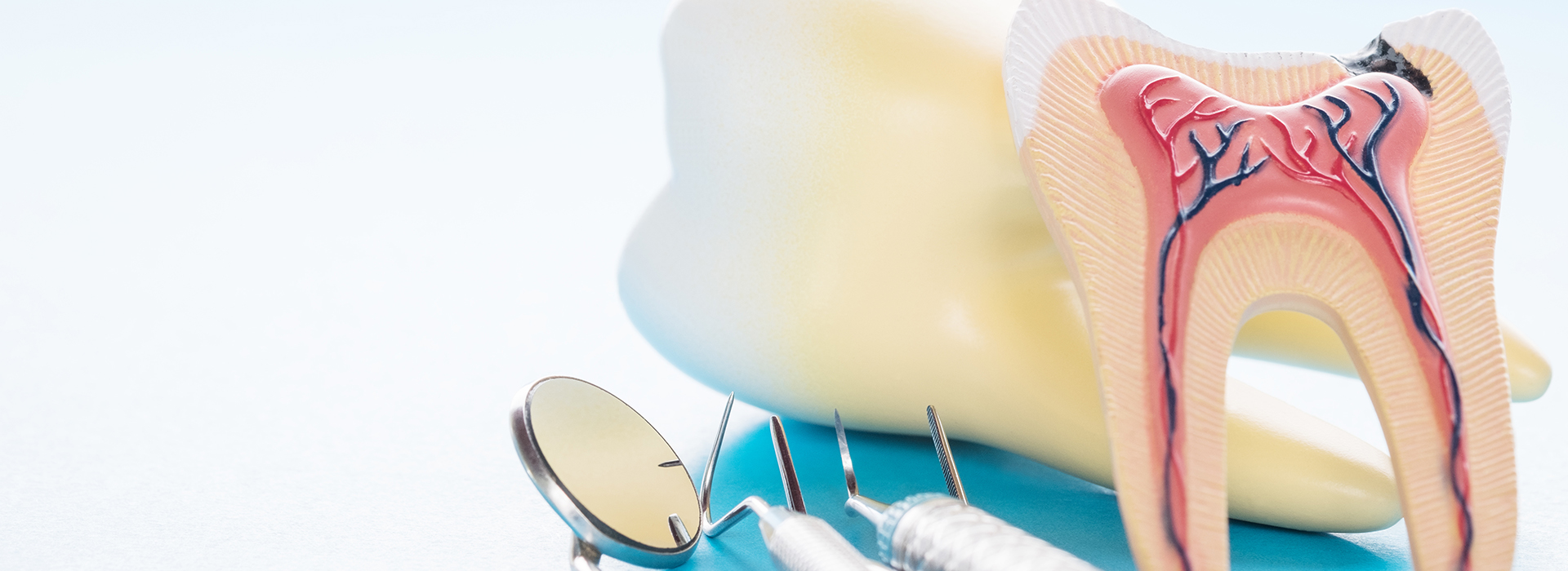 The image shows a dental hygiene kit with toothbrushes and floss, placed against a background that includes an illustration of a mouth with teeth and gums.